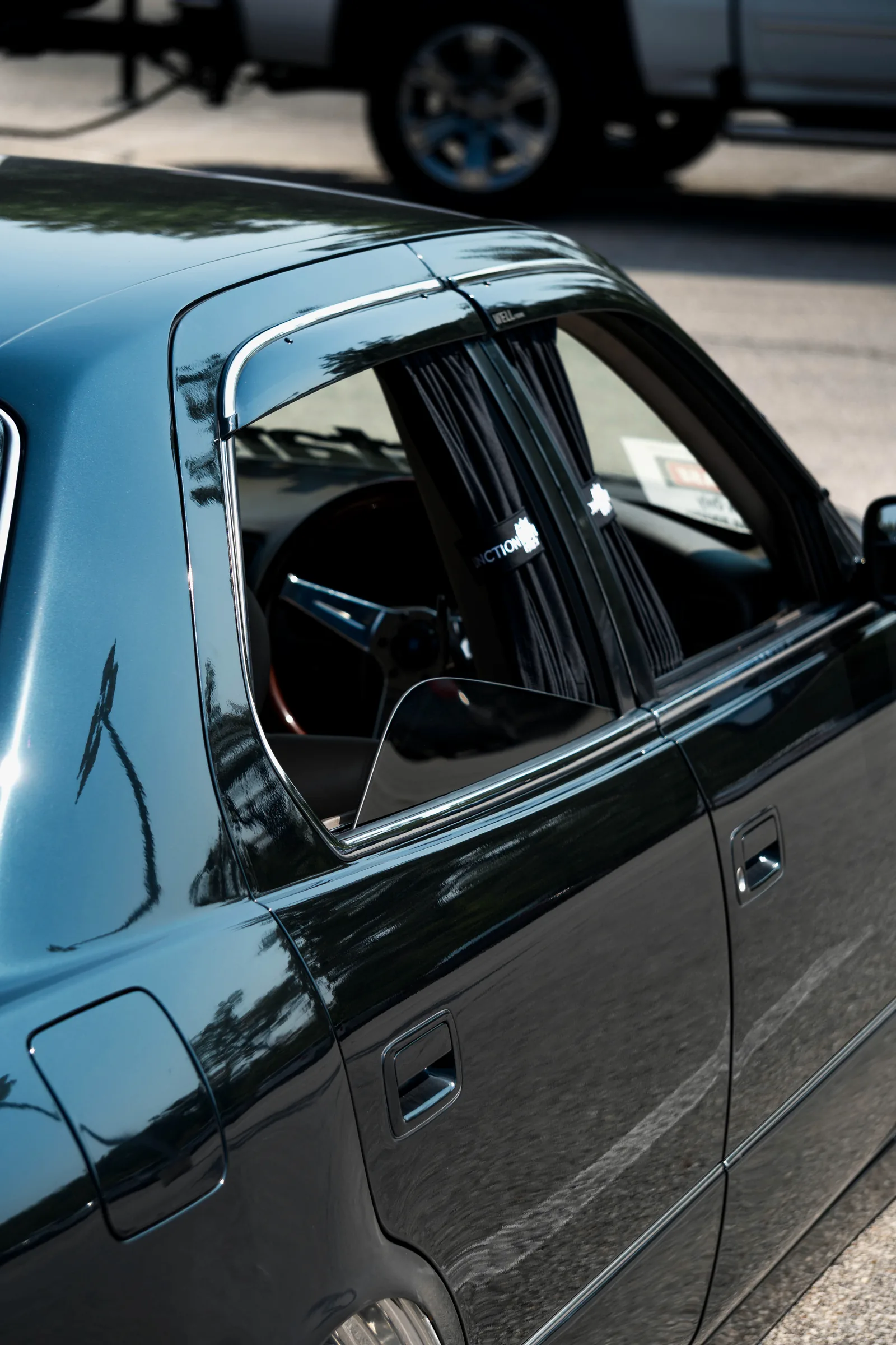 Close-up of a chrome BBS-style wheel on a bagged Toyota Celsior