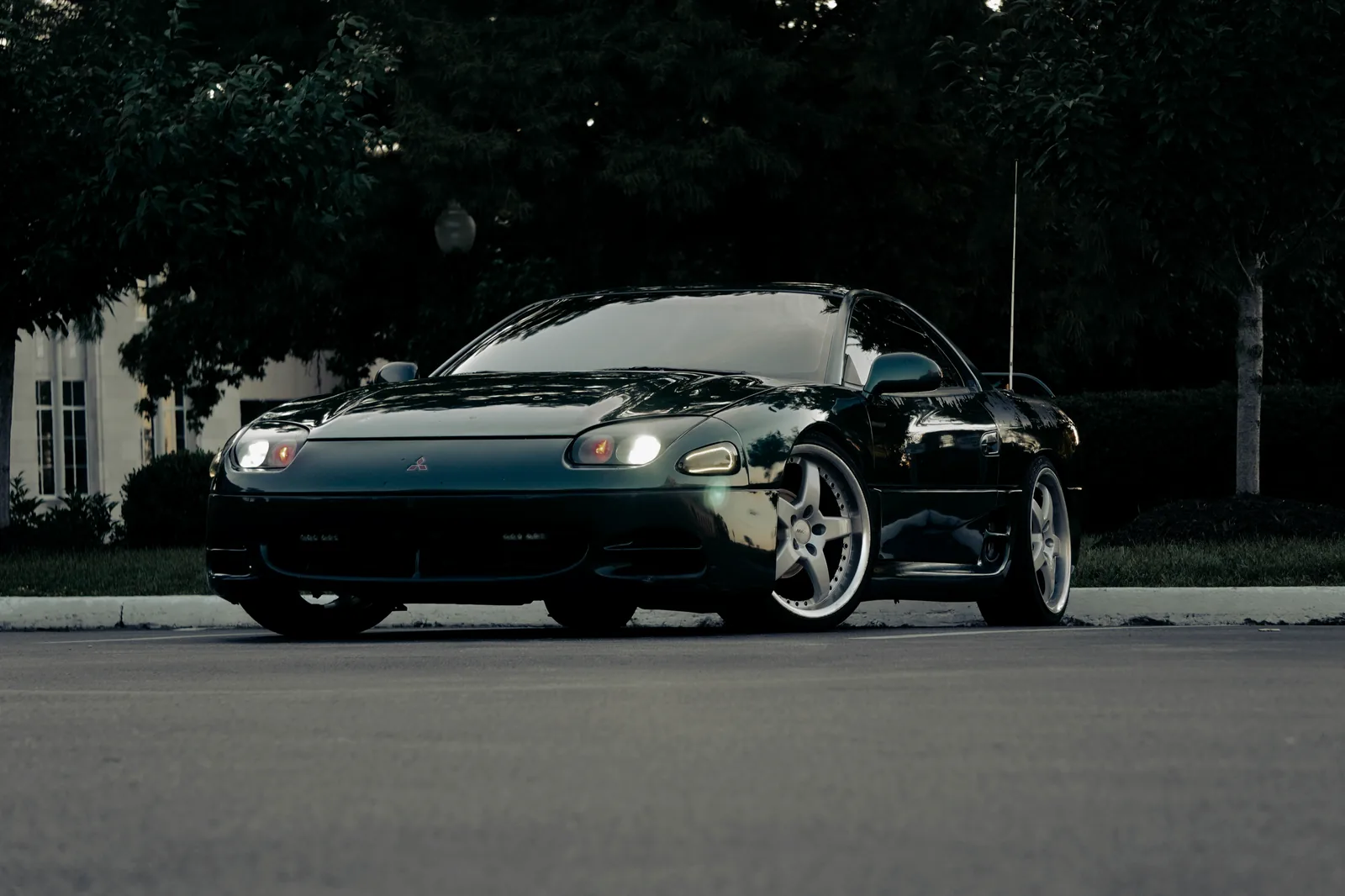 Mitsubishi 3000GT VR-4 at dusk with headlights on